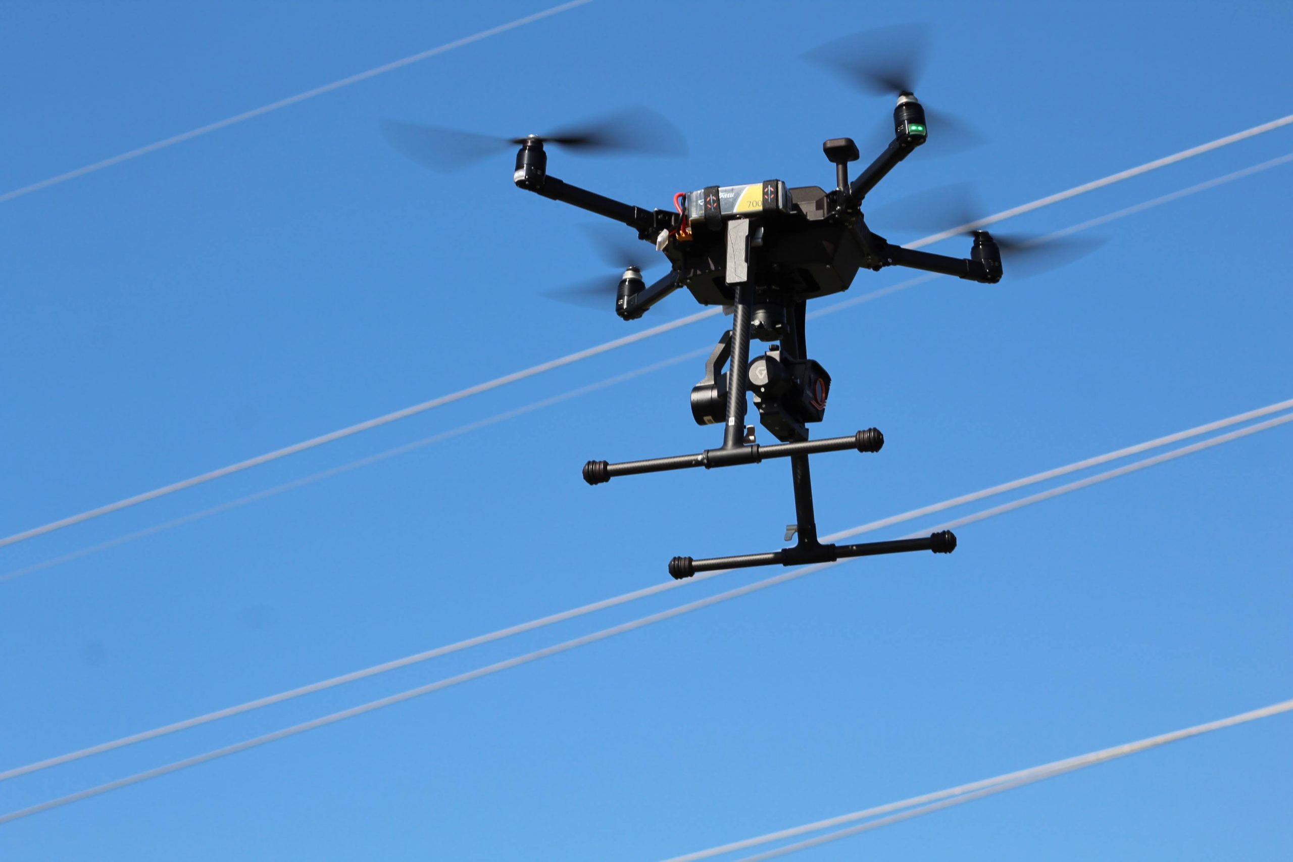 drone in front of electric wires