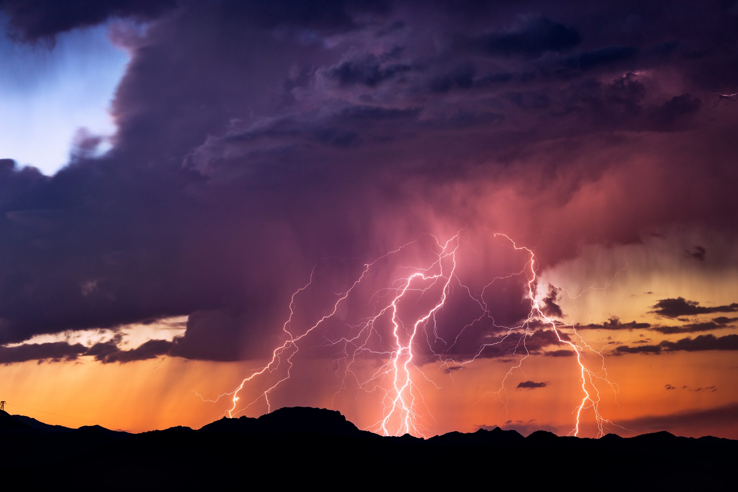 colorful storm clouds with powerful lightning strikes